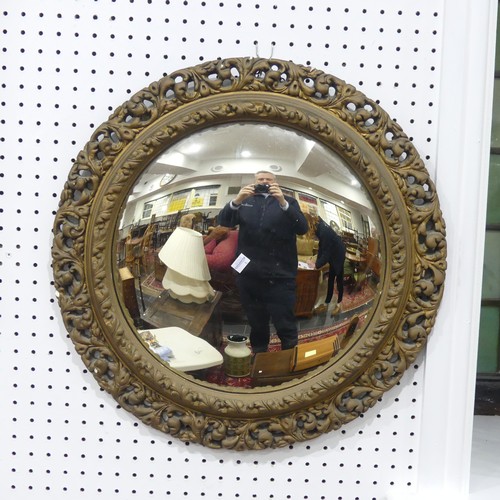 603 - A carved giltwood framed circular convex Wall Mirror, 57cm diameter.