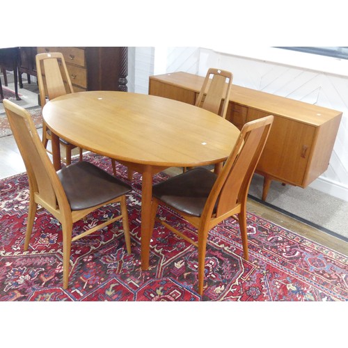 605 - A Danish teak extending Dining Table, unstamped, W 149cm x H 72cm x D 104cm, with four Eva teak Dini... 