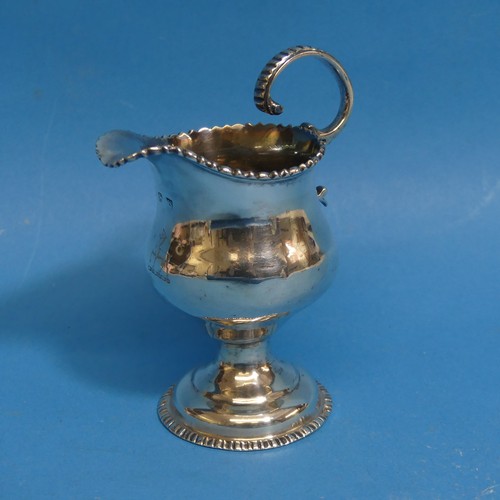 81 - A George III silver Cream Jug, hallmarked London, 1761, of baluster form with scroll handle and gadr... 