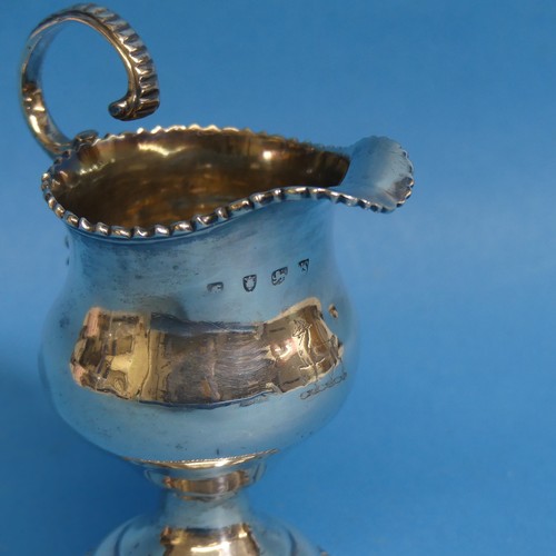 81 - A George III silver Cream Jug, hallmarked London, 1761, of baluster form with scroll handle and gadr... 