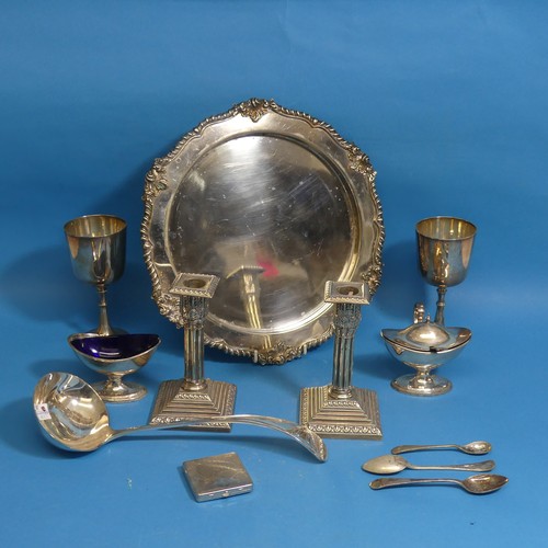 73 - A quantity of Silver Plate, including a pair of early 20thC Corinthian column candlesticks, a salver... 