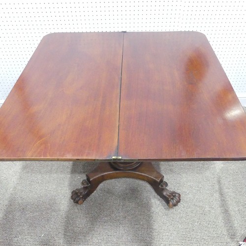 615 - A George IV mahogany D-shaped Tea Table, raised on a central fluted column with four outswept legs t... 