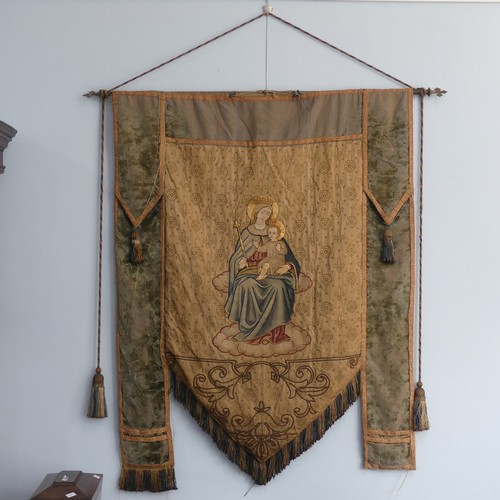 612 - Ecclesiastical interest; a 19thC church pennant depicting Madonna and Child, fabric worn and faded, ... 