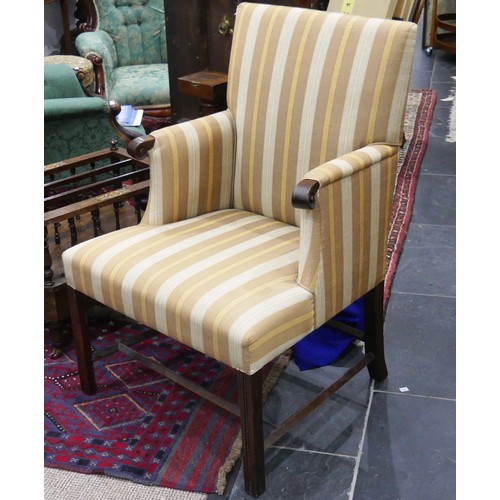 610 - A Georgian upholstered elbow Chair, with mahogany frame, on reeded block legs, upholstered in stripe... 