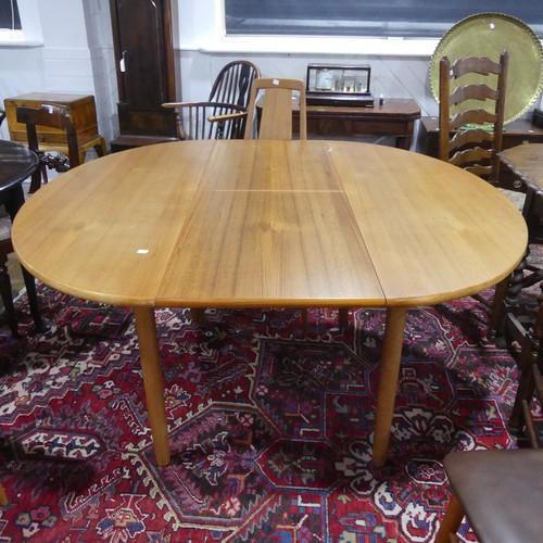 605 - A Danish teak extending Dining Table, unstamped, W 149cm x H 72cm x D 104cm, with four Eva teak Dini... 