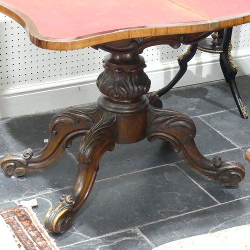 598 - A Victorian mahogany fold-over Card Table, with shaped top raised on a carved and turned base, W 93c... 