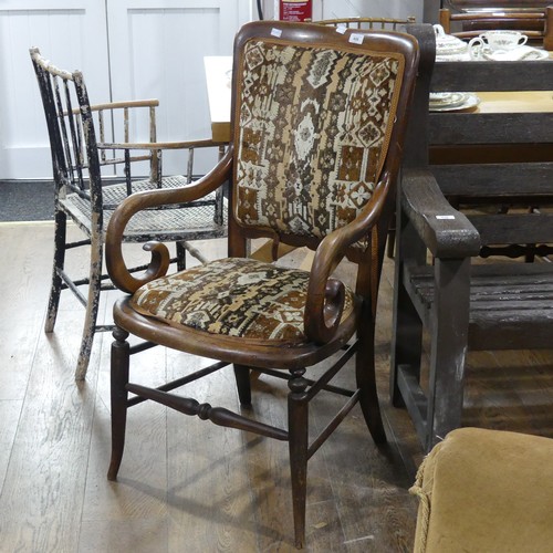 606 - A early 20thC walnut and elm upholstered carver Chair, with scroll arms.