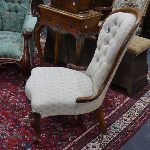 609 - A Victorian walnut-framed button-back Nursing Chair, with serpentine front, upholstered in Belgian w... 