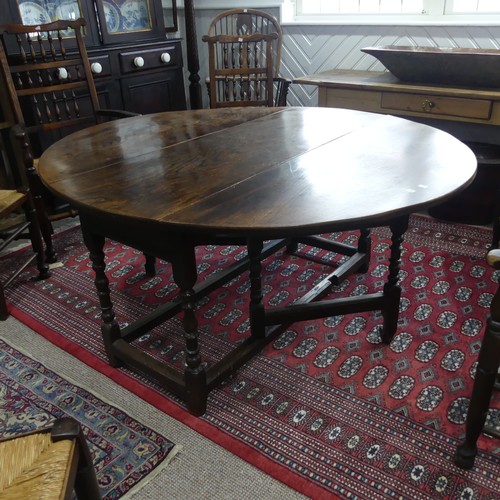 439 - An antique oak gate-leg Dining Table, with turned and block legs, W 137cm x L 150cm x H 72cm.... 