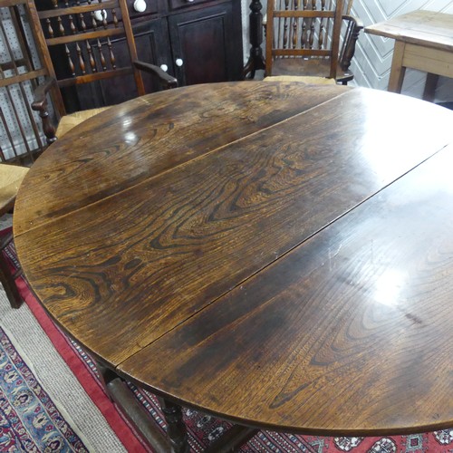 439 - An antique oak gate-leg Dining Table, with turned and block legs, W 137cm x L 150cm x H 72cm.... 