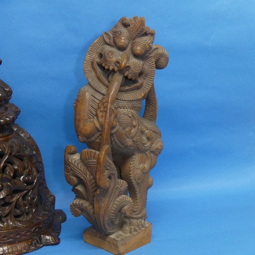 143 - A pair of Indian carved wooden Yali, with mobile ball in mouth, together with an Oriental Wall Brack... 