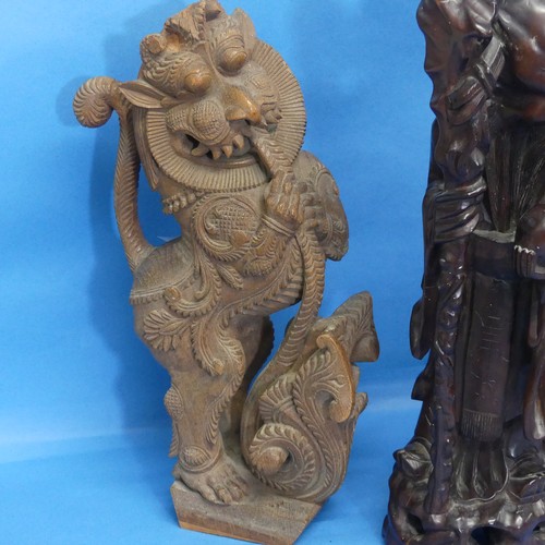 143 - A pair of Indian carved wooden Yali, with mobile ball in mouth, together with an Oriental Wall Brack... 