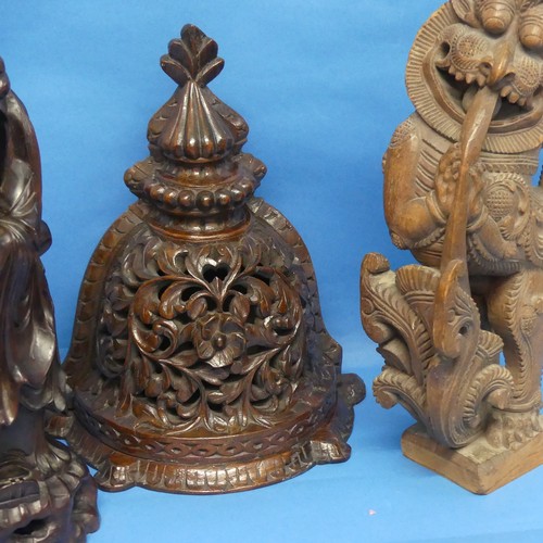 143 - A pair of Indian carved wooden Yali, with mobile ball in mouth, together with an Oriental Wall Brack... 