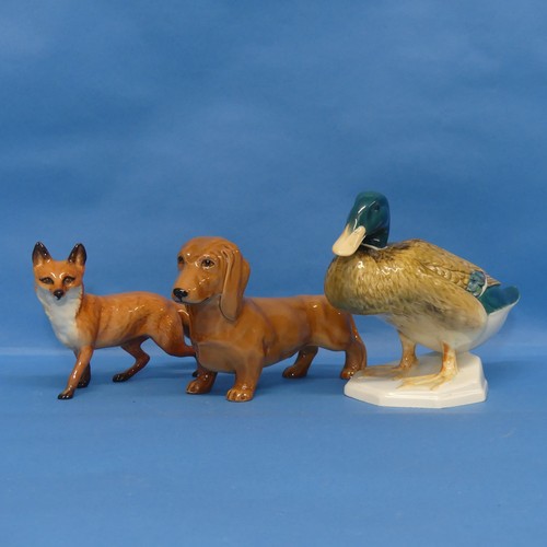 9 - A Beswick figure of a Duck, numbered 817, together with a Beswick Sausage Dog and a Beswick Fox (3)... 