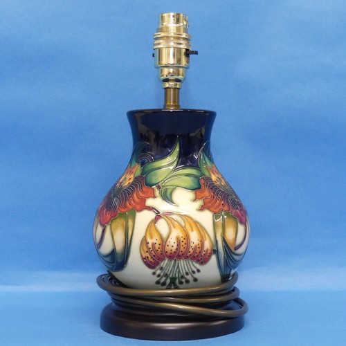 37 - A Moorcroft pottery 'Anna Lilly' pattern Lamp and Shade, on fitted wooden plinth, with mark to base,... 