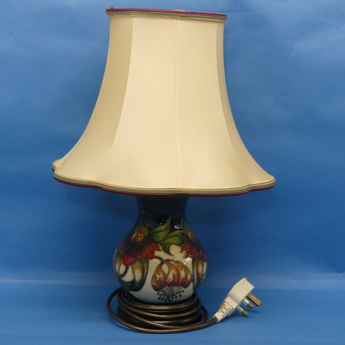 37 - A Moorcroft pottery 'Anna Lilly' pattern Lamp and Shade, on fitted wooden plinth, with mark to base,... 