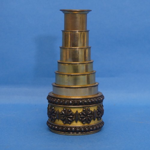 A 19thC six draw gilt brass Monocular, the barrel mounted with cut steel, 3.7cm closed, 10.3cm fully extended.