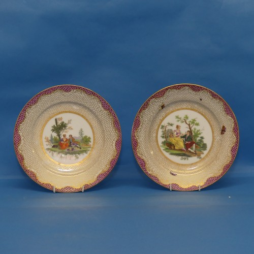 66 - A near pair of continental porcelain Cabinet Plates, each decorated centrally with classical scenes,... 