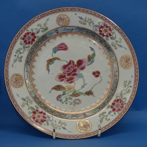 155 - A pair of 18thC Chinese porcelain famille rose Plates, decorated in typical style, depicting floral ... 