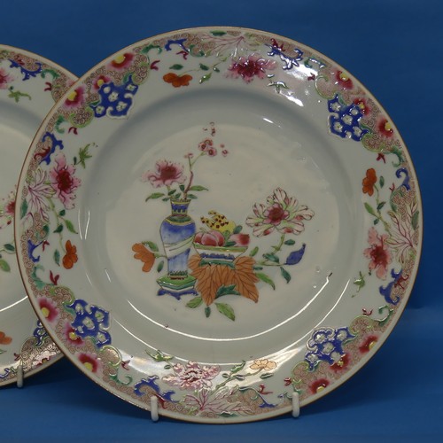 156 - A pair of 18thC Chinese porcelain famille rose Plates, decorated in flora with central still life de... 