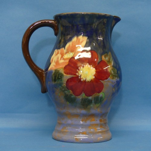 73 - A Royal Doulton floral pattern Jug, with factory marks and numbered D8227 to base, H 21cm.... 