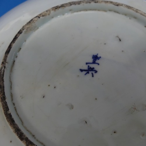 166 - Two Chinese blue and white Ginger Jars, with prunus flower pattern, H 14cm, together with an orienta... 