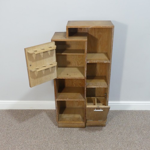 402 - A Heals style limed oak stepped Bookcase/Smokers/Drinks Compendium, circa 1930's, with open shelves ... 