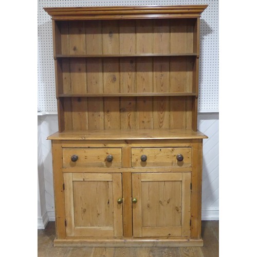 430 - A Victorian pine Dresser Base, with later plate rack, W 140cm x H 214cm x D45cm.