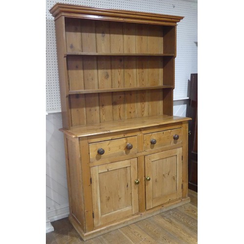 430 - A Victorian pine Dresser Base, with later plate rack, W 140cm x H 214cm x D45cm.