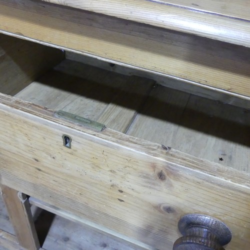 430 - A Victorian pine Dresser Base, with later plate rack, W 140cm x H 214cm x D45cm.