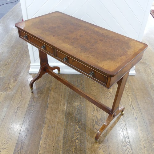 444 - A good quality reproduction burr walnut Sofa Table, the quarter-veneered top edged with cross bandin... 