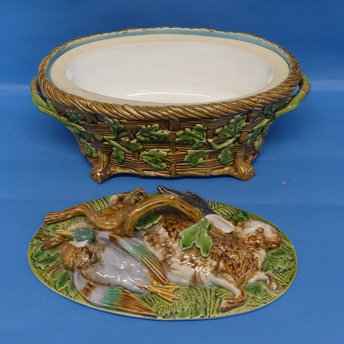 105 - A Minton majolica Game Pie Dish and Cover, late 19thC, the lid modelled as game resting on ferns and... 