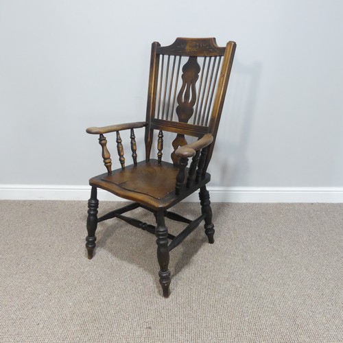 454 - An early 20thC spindle and splat back Country Chair, with carved back and double stretcher.... 