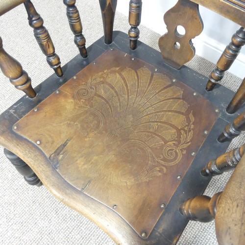 454 - An early 20thC spindle and splat back Country Chair, with carved back and double stretcher.... 