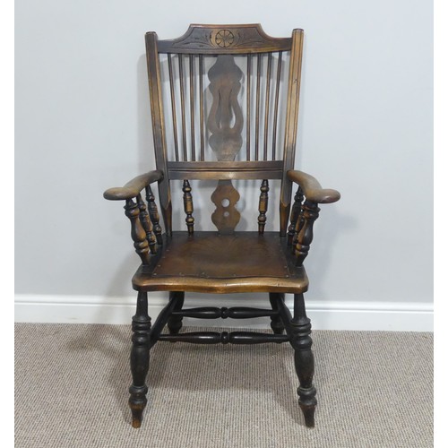 454 - An early 20thC spindle and splat back Country Chair, with carved back and double stretcher.... 