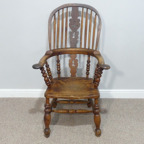 456 - A 19thC Windsor Armchair, with spindle and splat back, raised on bobbin turned supports, W 67cm x H ... 