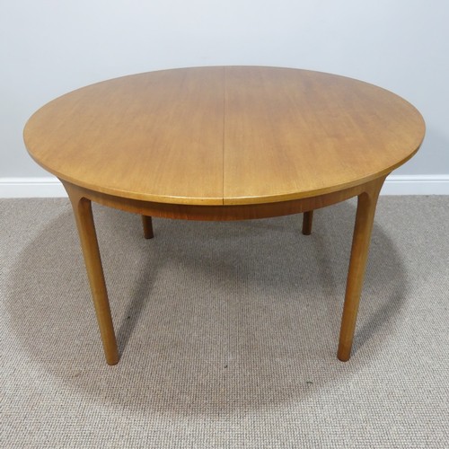 469 - A retro teak extending circular Dining Table and six Dining Chairs by A H McIntosh & Co., the ta... 