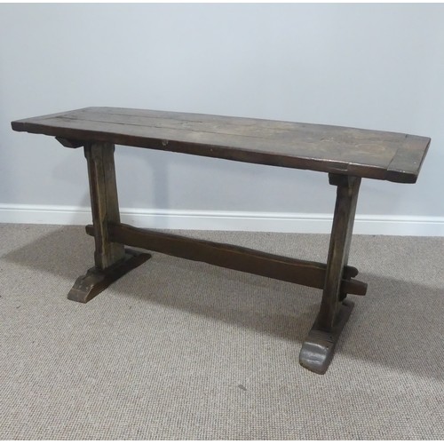 474 - An antique oak plank top Refectory Table, the top with cleated ends, timber is in an overall worn co... 