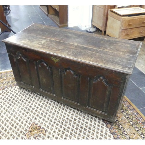 476 - An 18thC oak Coffer, the front with four Gothic-shaped arched panels, one side with a rectangular pa... 