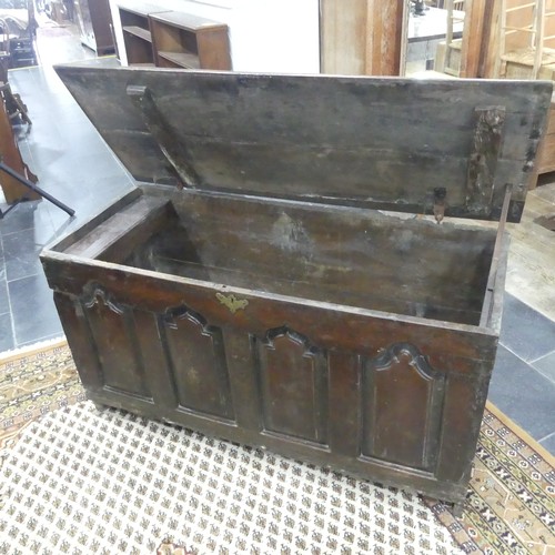 476 - An 18thC oak Coffer, the front with four Gothic-shaped arched panels, one side with a rectangular pa... 