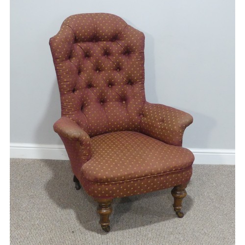 484 - A Victorian upholstered button-back Armchair, raised on turned legs and casters, some woodworm, W 71... 