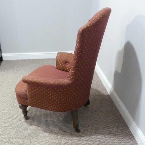 484 - A Victorian upholstered button-back Armchair, raised on turned legs and casters, some woodworm, W 71... 