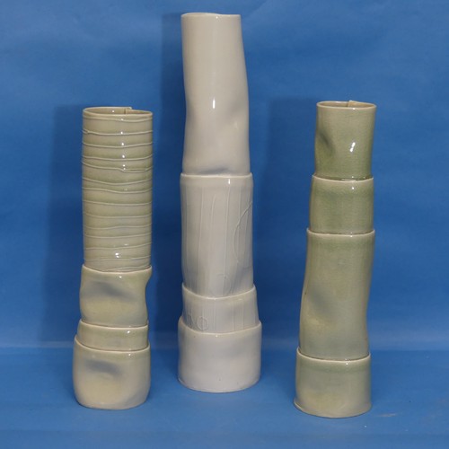 140 - A trio of modern chimney-like Vases, in pale green shades, with tube lined decoration, the tallest 3... 