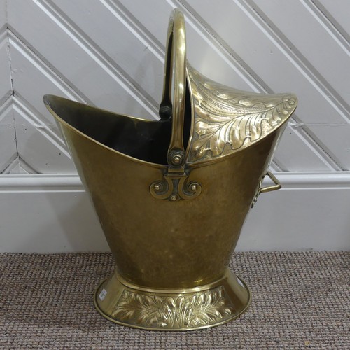 472 - An Art Nouveau brass Coal Bucket, embossed with panels of stylised foliate decoration, W 42cm x H 53... 