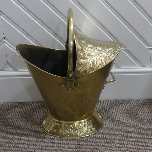 472 - An Art Nouveau brass Coal Bucket, embossed with panels of stylised foliate decoration, W 42cm x H 53... 