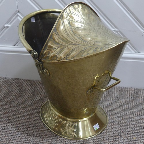 472 - An Art Nouveau brass Coal Bucket, embossed with panels of stylised foliate decoration, W 42cm x H 53... 