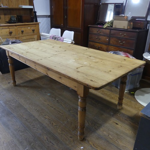 480 - A vintage pine Kitchen Table, with rectangular top over single frieze drawer, raised on turned legs,... 