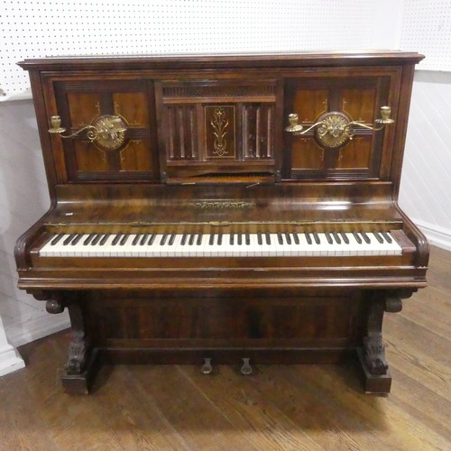 491 - A late Victorian Collard and Collard upright rosewood piano, with brass candle sconces and hinged mu... 