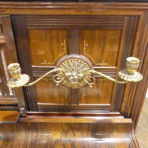 491 - A late Victorian Collard and Collard upright rosewood piano, with brass candle sconces and hinged mu... 