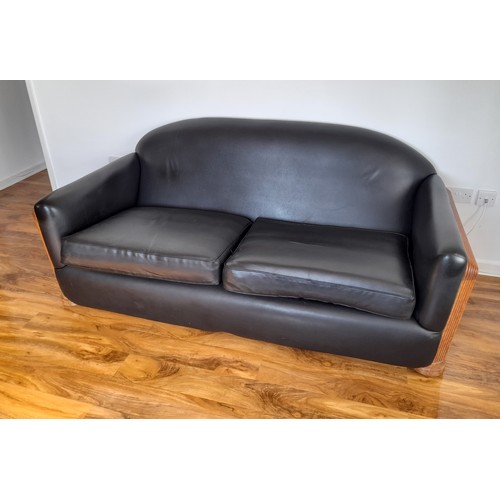 489 - An Art Deco style black leatherette Three Piece Suite, with reeded light wood arms and replacement u... 